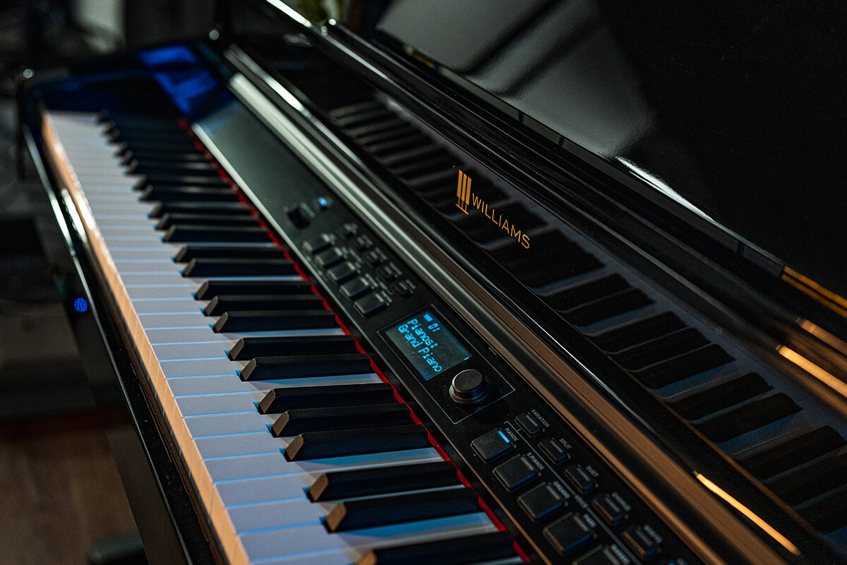Williams Overture III digital console piano close up.